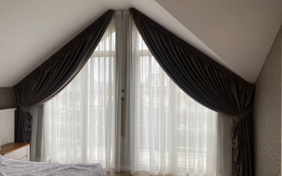 Curtains on a slanted window