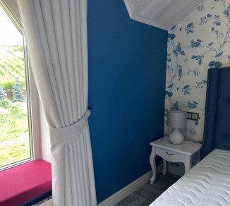 Curtains on hooks for a hotel room 20202286