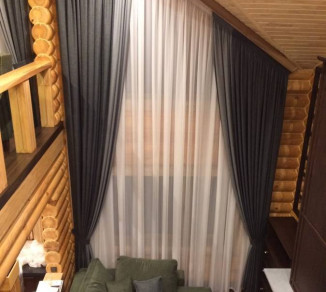 Curtains on hooks and tulle on a slanted window 20202188