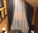 Curtains on hooks and tulle on a slanted window 20202188