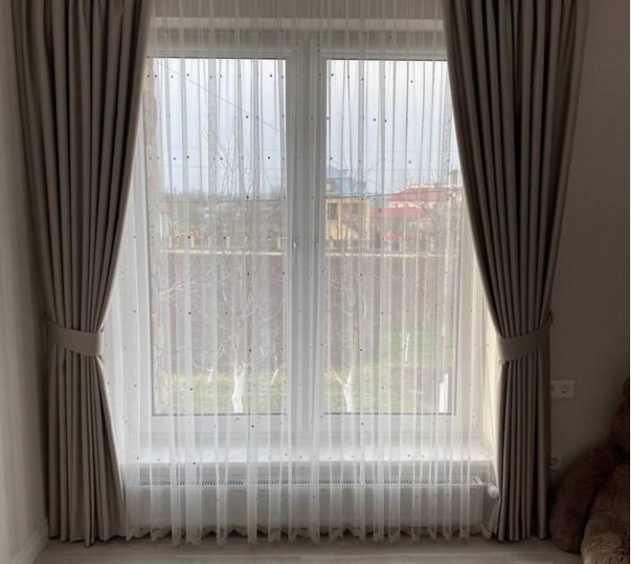 Curtains on hooks and tulle with embroidery in the nursery 20202194